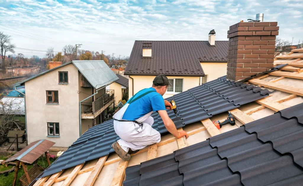 Contructor in Blue Shirt Working on New Roofing in Texas - TSG Roofing
