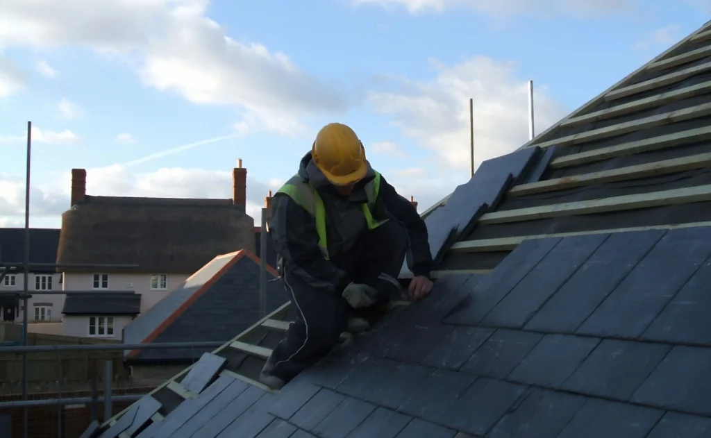 Contractor Working on Roof Tiles in Texas - TSG Roofing