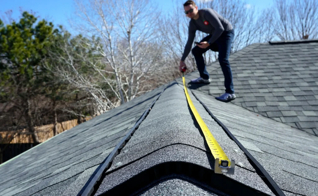 Contractor Measuring the Roof in Texas - TSG Roofing